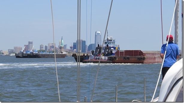 visasmallOne of the many barges being pushed by a tug into New York Harbourdavid